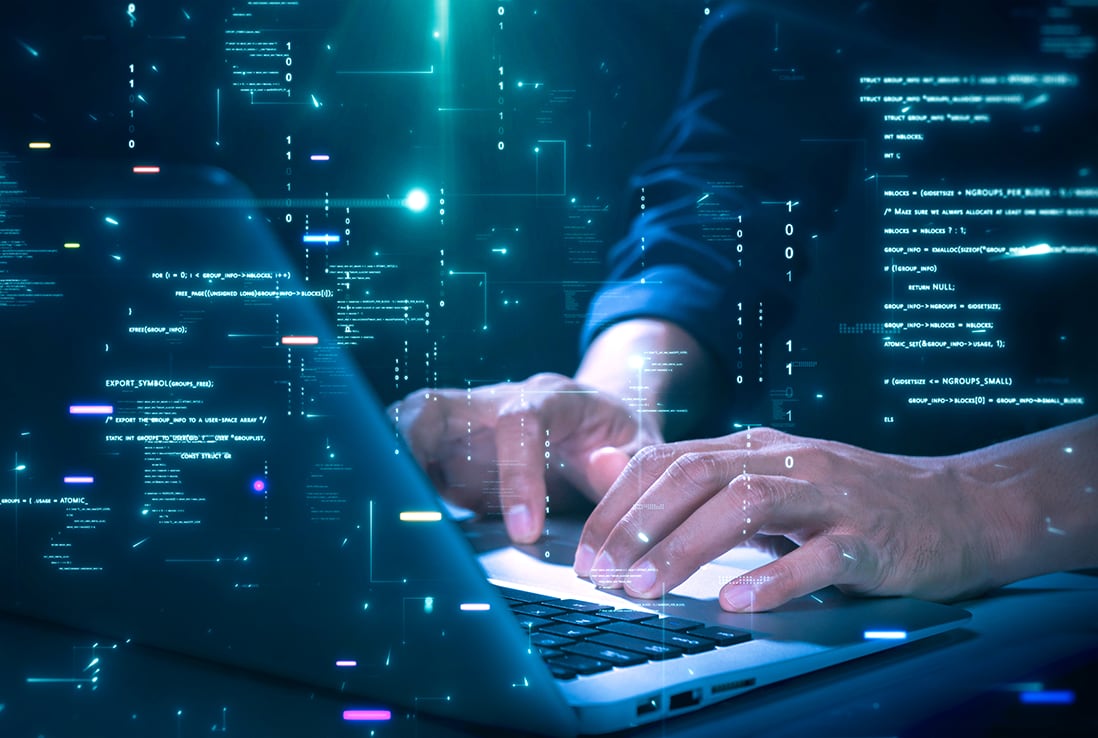 Cyber hands typing on a laptop