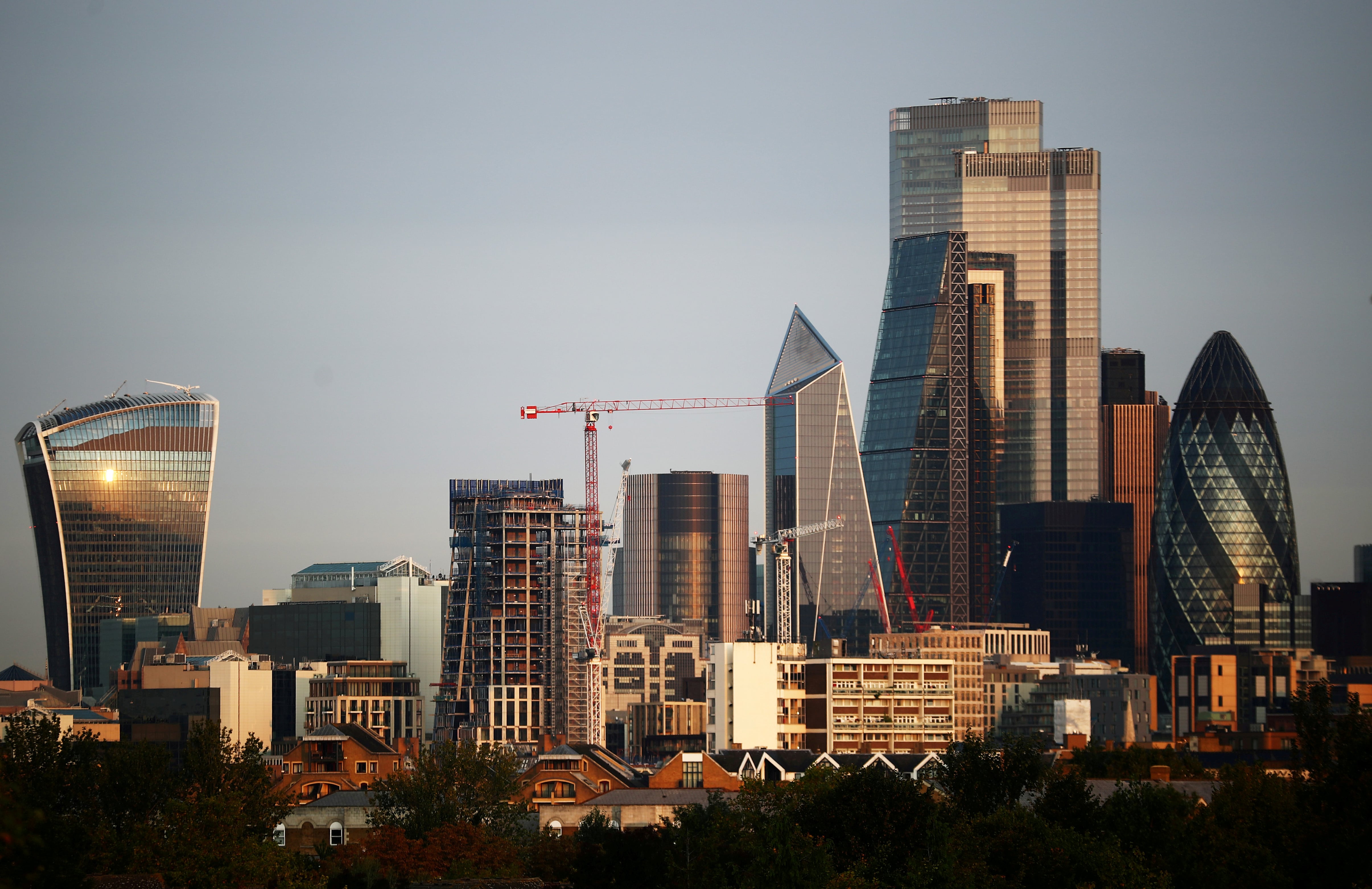 Skyscrapers in The City of London financial district are seen during sunrise in London