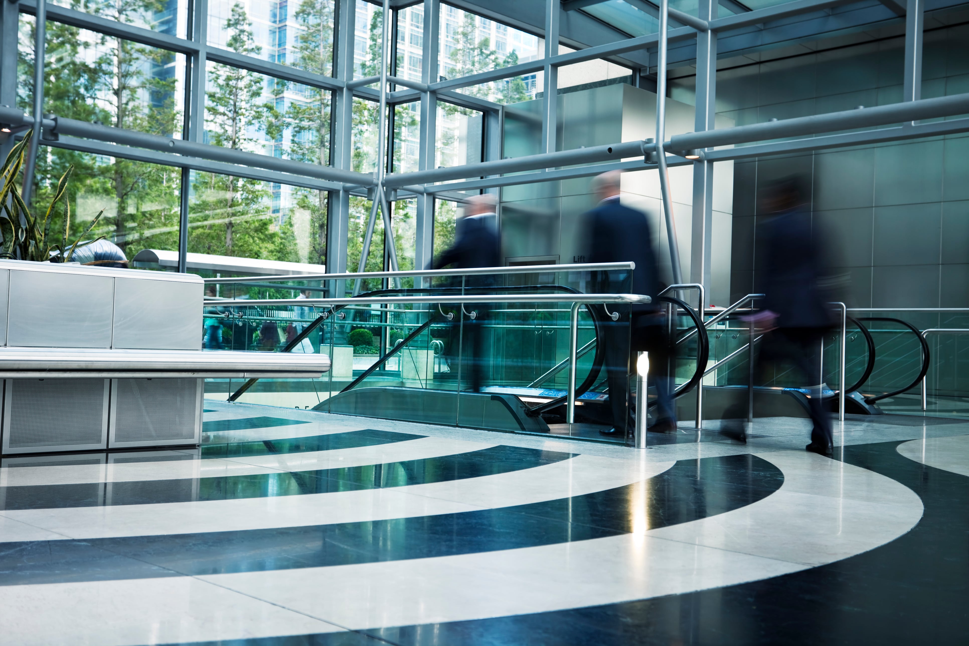 People moves, business people walking to escalator