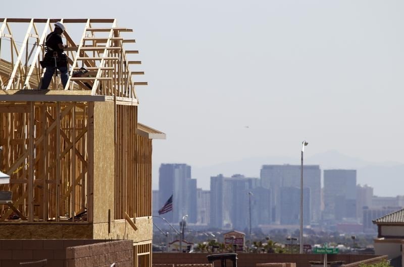 A carpenter works on a new home at a residential construction site in the west side of the Las Vegas Valley in Las Vegas