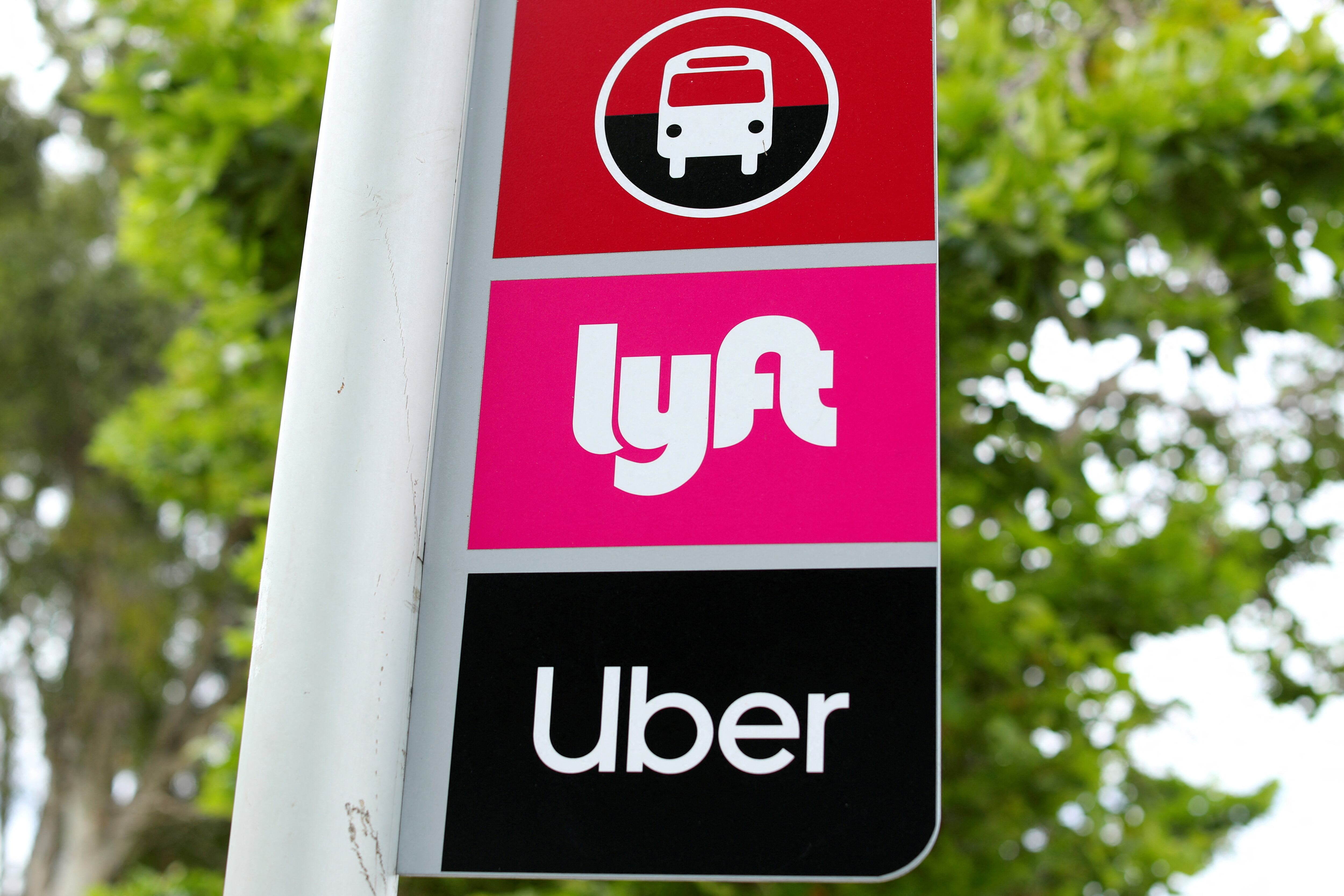 A sign marks a rendezvous location for Lyft and Uber users at San Diego State University in San Diego