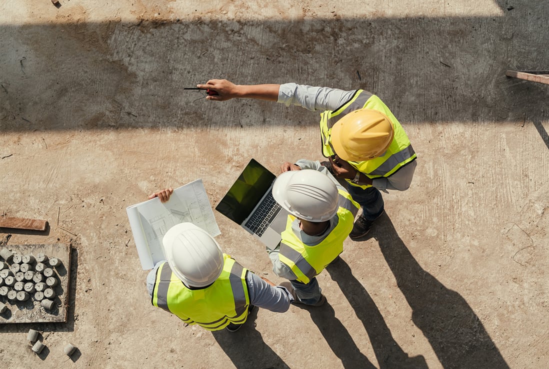 Stock image shows engineers working on a construction site