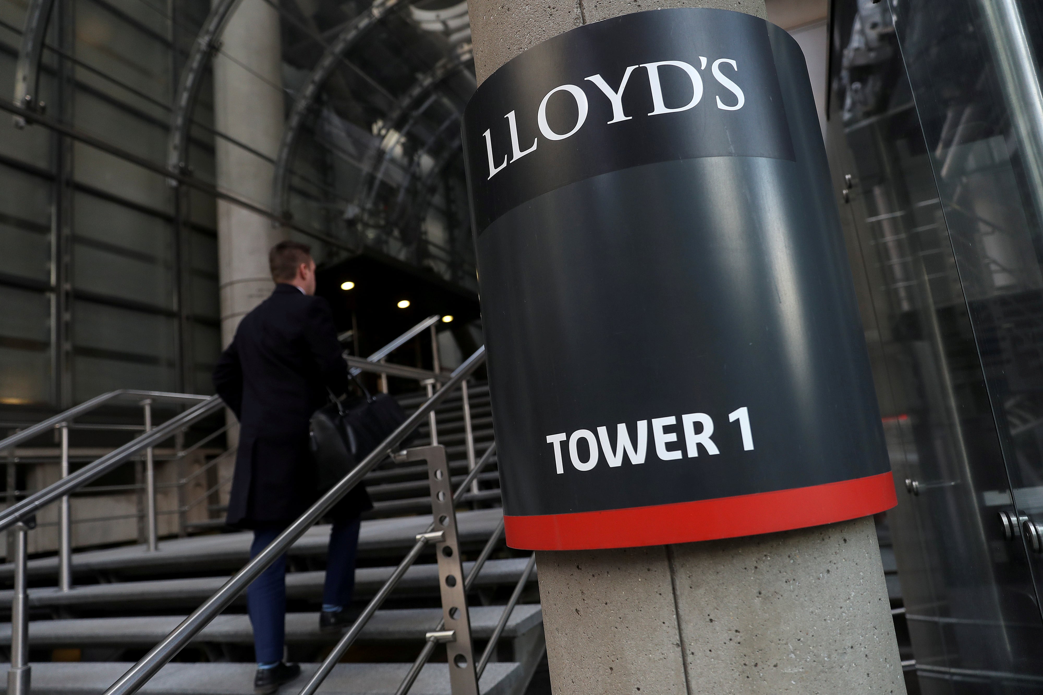 A worker enters the Lloyd's of London building in the City of London financial district