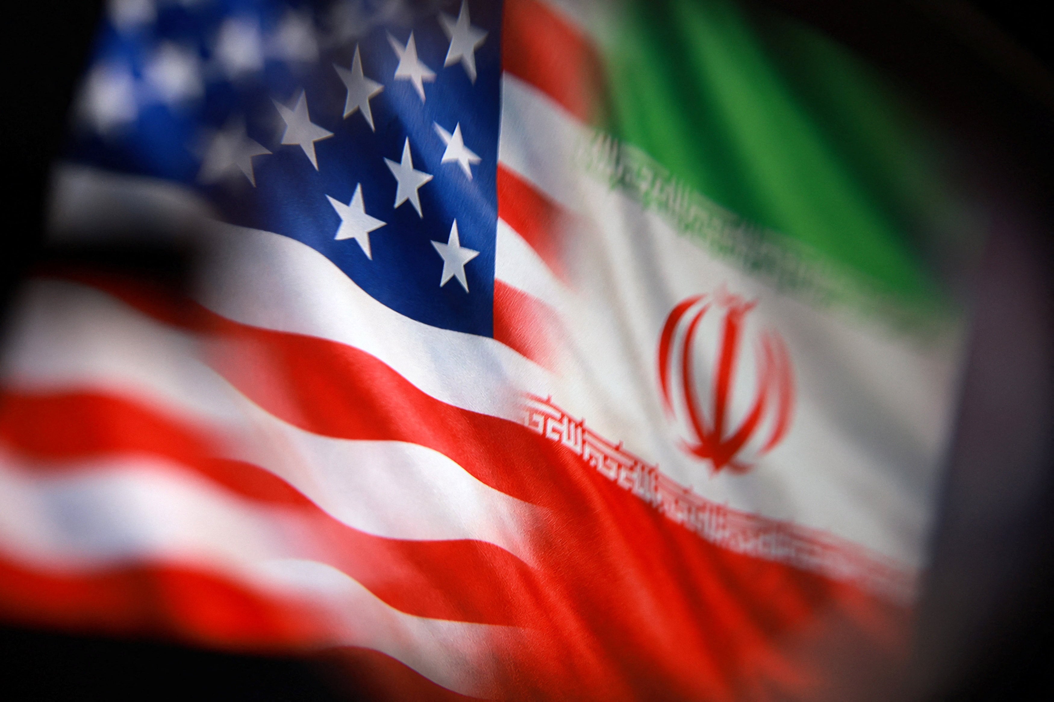 Illustration shows U.S. and Iranian flags